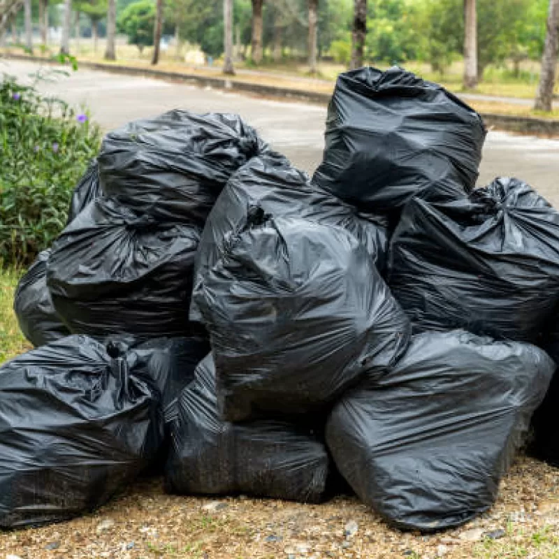Heavy-duty waste bags in use for garbage collection